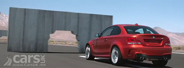 BMW 1 Series M Coupe driving through concrete blocks
