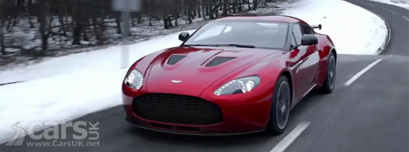 Red Aston Martin V12 Zagato driving on mountain road