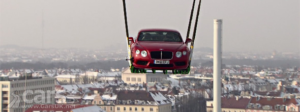 Bentley Continental V8 flying across Munich beneath a Helicopter