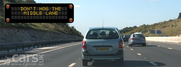 Photo of car hogging middle lane on motorway
