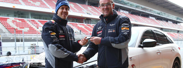 Photo of Sebastian Vettel taking delivery of Infiniti FX Vettel Edition