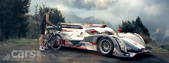 Audi R18 e-tron quattro with cyclist photo