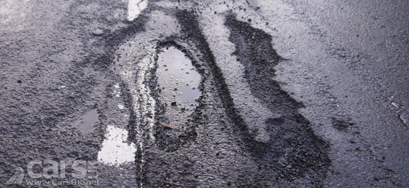 Photo Potholed Road UK