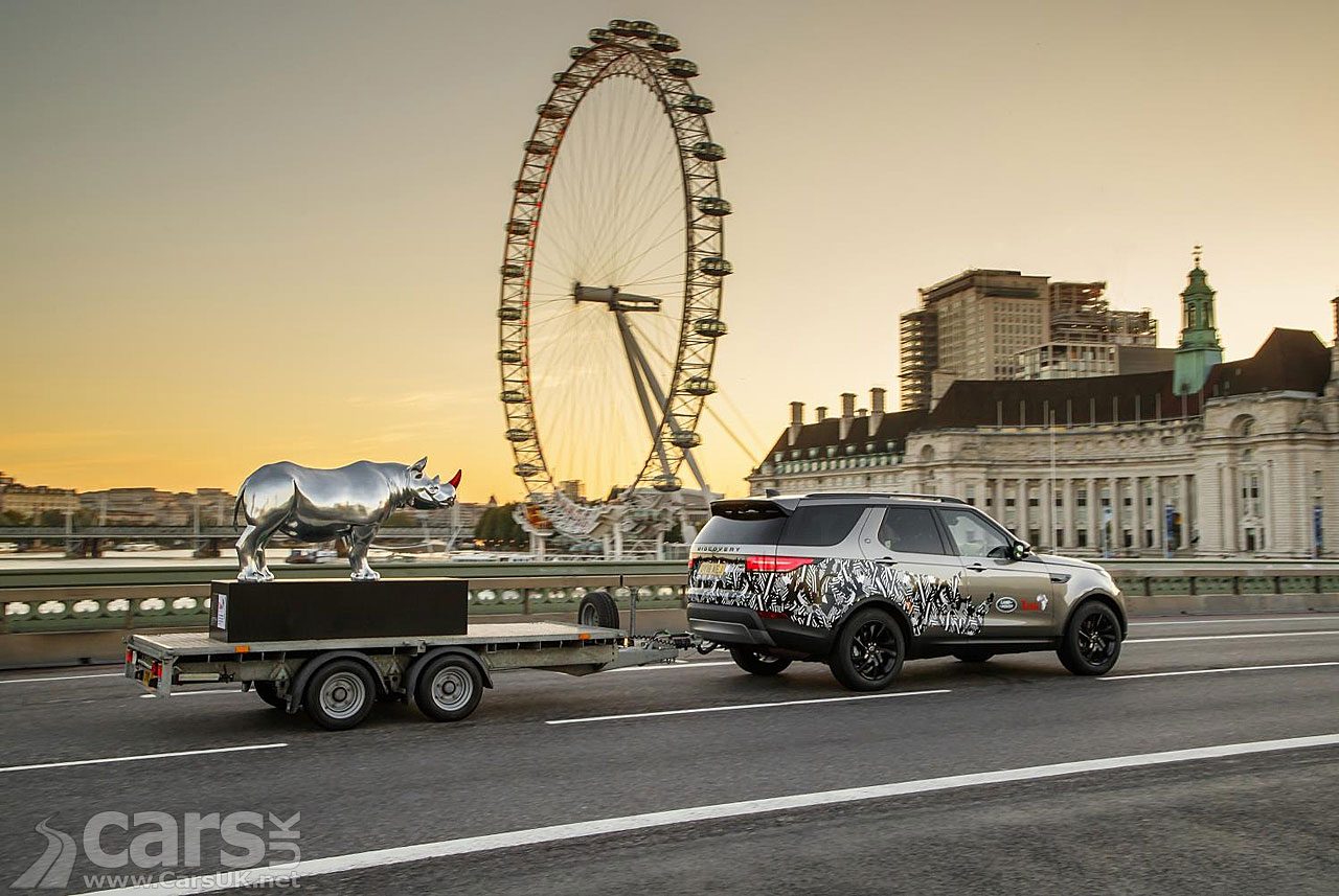 A Land Rover Discovery tows Gerry McGovern's Chrome Rhino over Westminster Bridge.