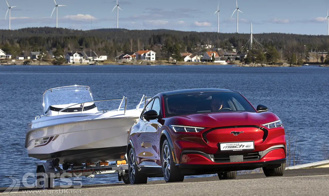 Electric Ford Mustang Mach-E towing a boat out of water