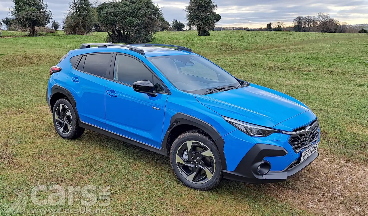 New Subaru Crosstrek in blue in a field front view