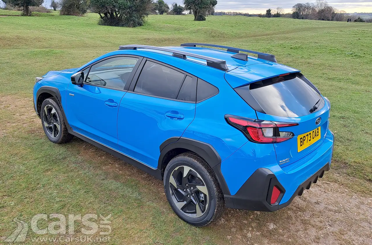 New Subaru Crosstrek in blue in a field rear view