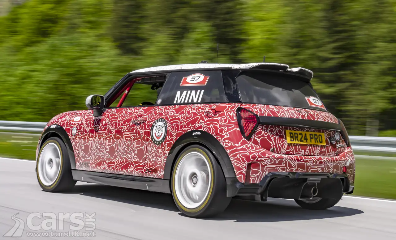 New MINI John Cooper Works with red and white camouflage on road rear view