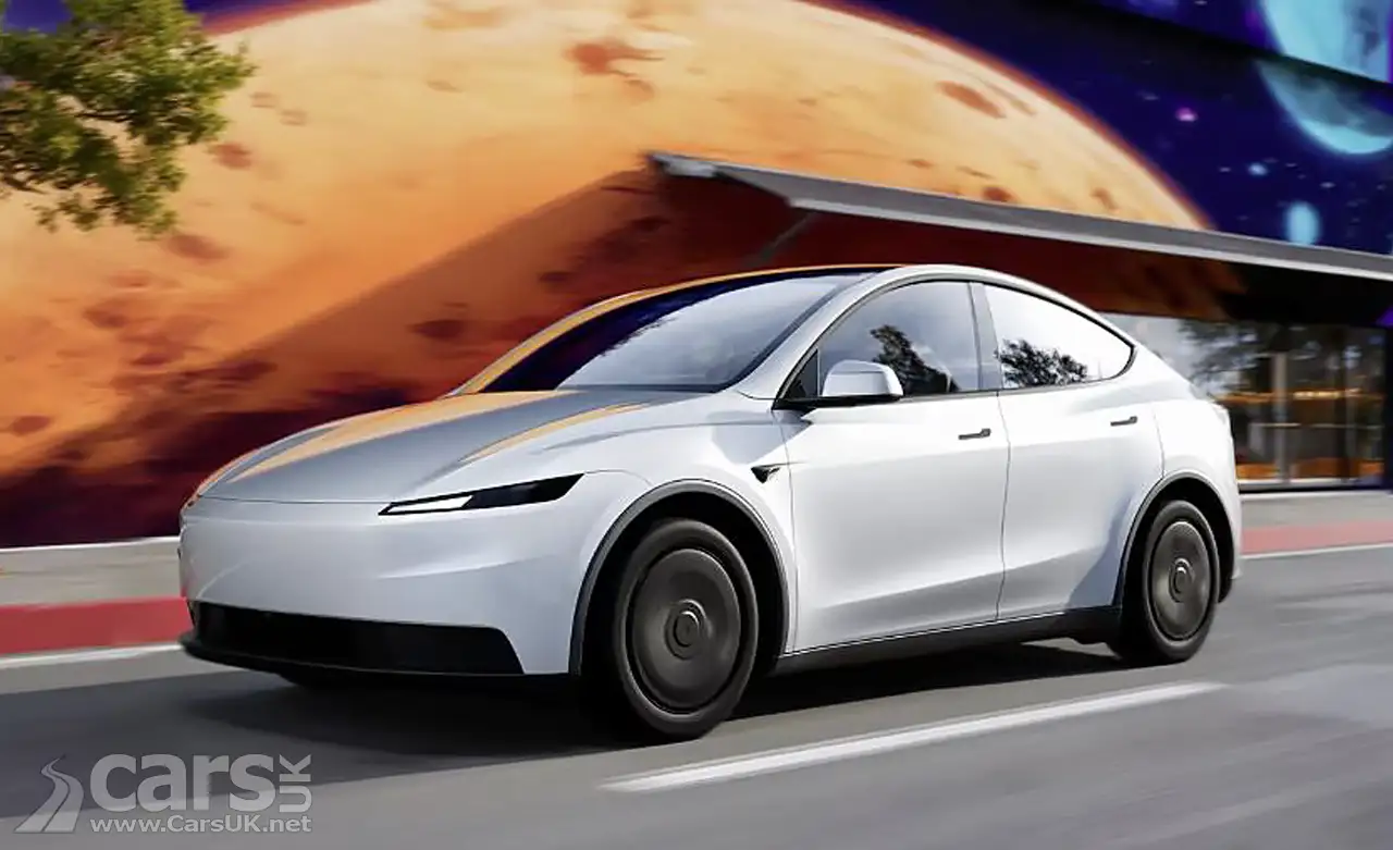 White Tesla Model Y Standard exterior photo on road