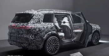 Audi Q9 erar three-quarters view camouflaged